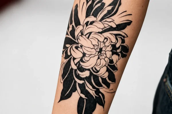 black-chrysanthemum-flower-arm-tattoo-wicked-ways-tattoos