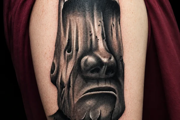black-grey-moai-stone-head-tattoo-wicked-tattoos