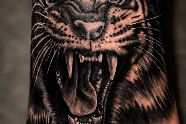 black-ink-tiger-roaring-hand-tattoo-wicked-ways-tattoos